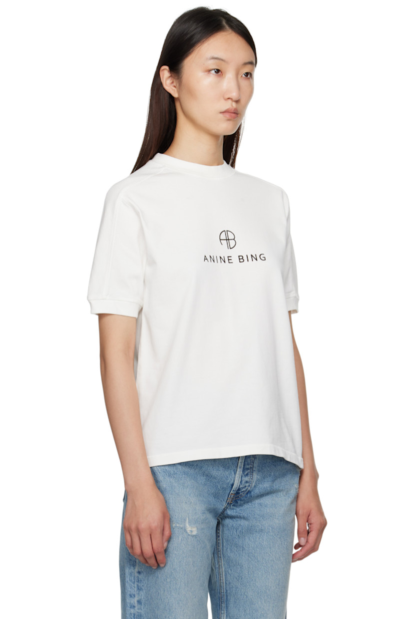Heavyweight cotton jersey T-shirt.

· Rib-knit crewneck and cuffs
· Logo and text printed at front
· Saddle shoulders
· Logo bonded at back collar

Supplier color: Ivory