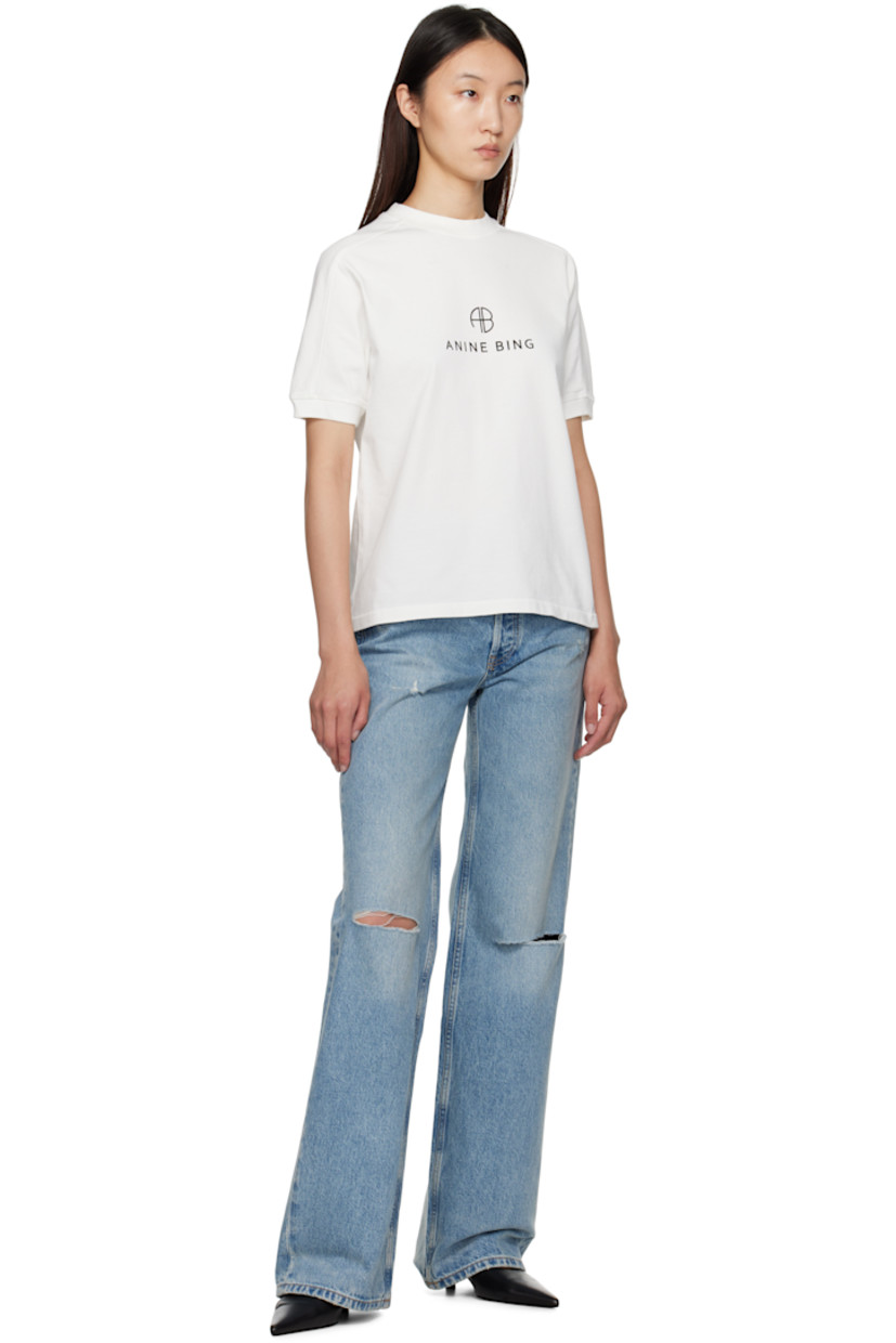 Heavyweight cotton jersey T-shirt.

· Rib-knit crewneck and cuffs
· Logo and text printed at front
· Saddle shoulders
· Logo bonded at back collar

Supplier color: Ivory