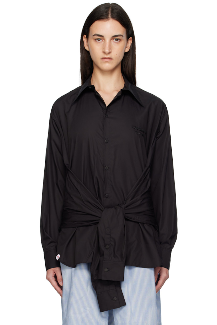 Cotton poplin shirt. 

· Spread collar
· Button closure
· Logo embroidered at chest
· Sleeve-style self-tie panels at waist
· Logo flag at front hem
· Shirttail hem
· Buttoned barrel cuffs
· Pleats at back yoke

Supplier color: Black