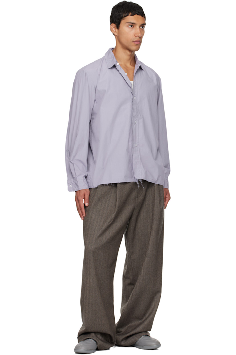 Virgin wool herringbone trousers.

· Wide straight-leg
· Raw edge at waistband
· Belt loops
· Three-pocket styling
· Zip fly
· Pleats at waist
· Dropped inseam
· Horn hardware

Supplier color: Herringbone