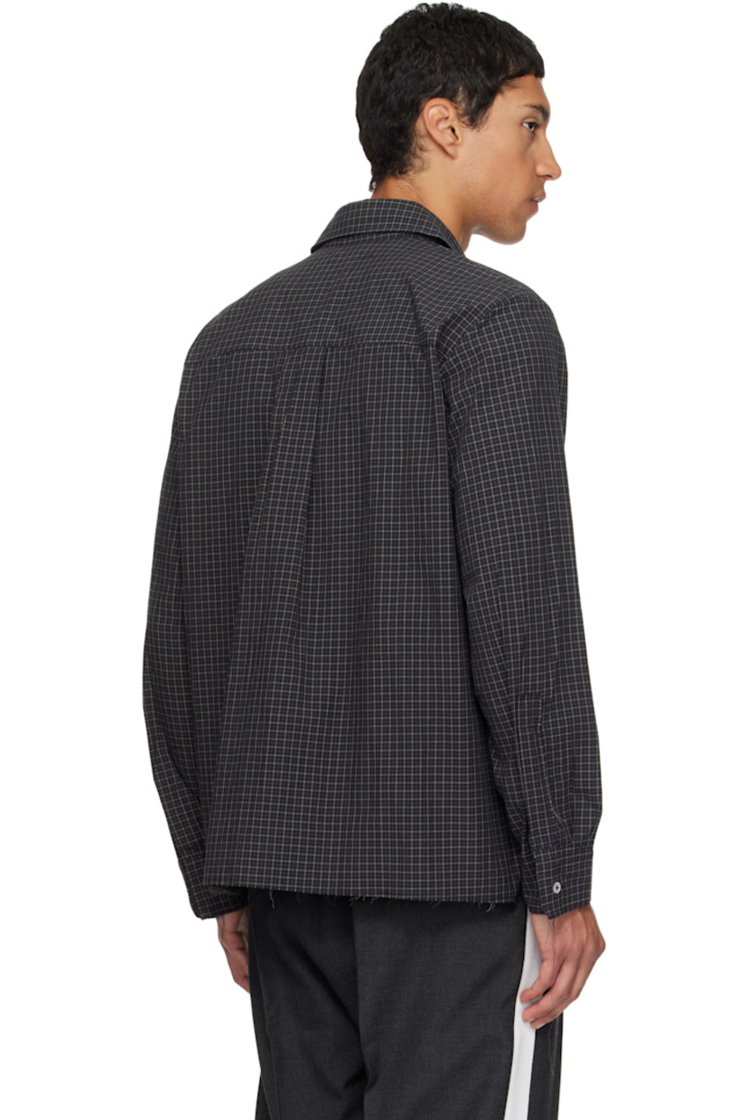 Cotton poplin shirt. 

· Check pattern and raw edges throughout 
· Spread collar 
· Button closure 
· Pleats at buttoned barrel cuffs
· Box pleat at back yoke 
· Mother-of-pearl hardware 

Supplier color: Black