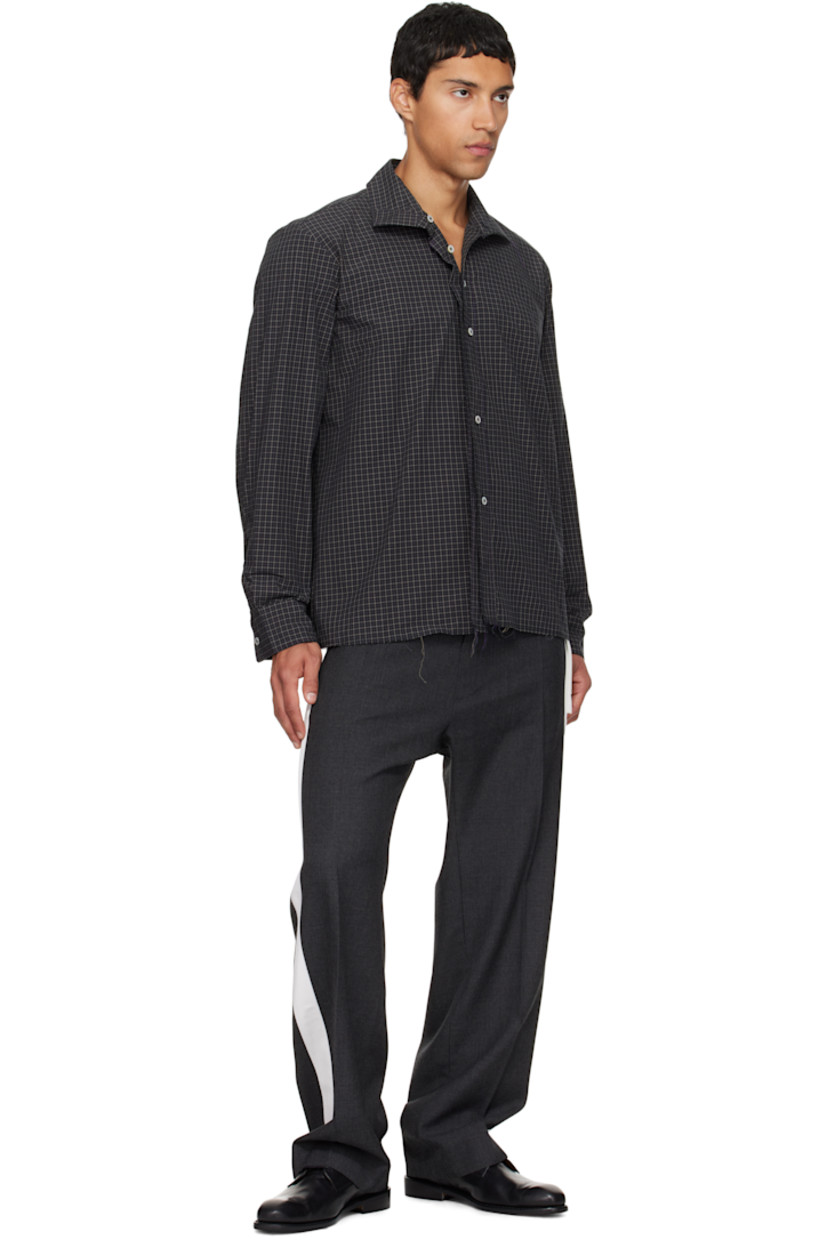 Cotton poplin shirt. 

· Check pattern and raw edges throughout 
· Spread collar 
· Button closure 
· Pleats at buttoned barrel cuffs
· Box pleat at back yoke 
· Mother-of-pearl hardware 

Supplier color: Black