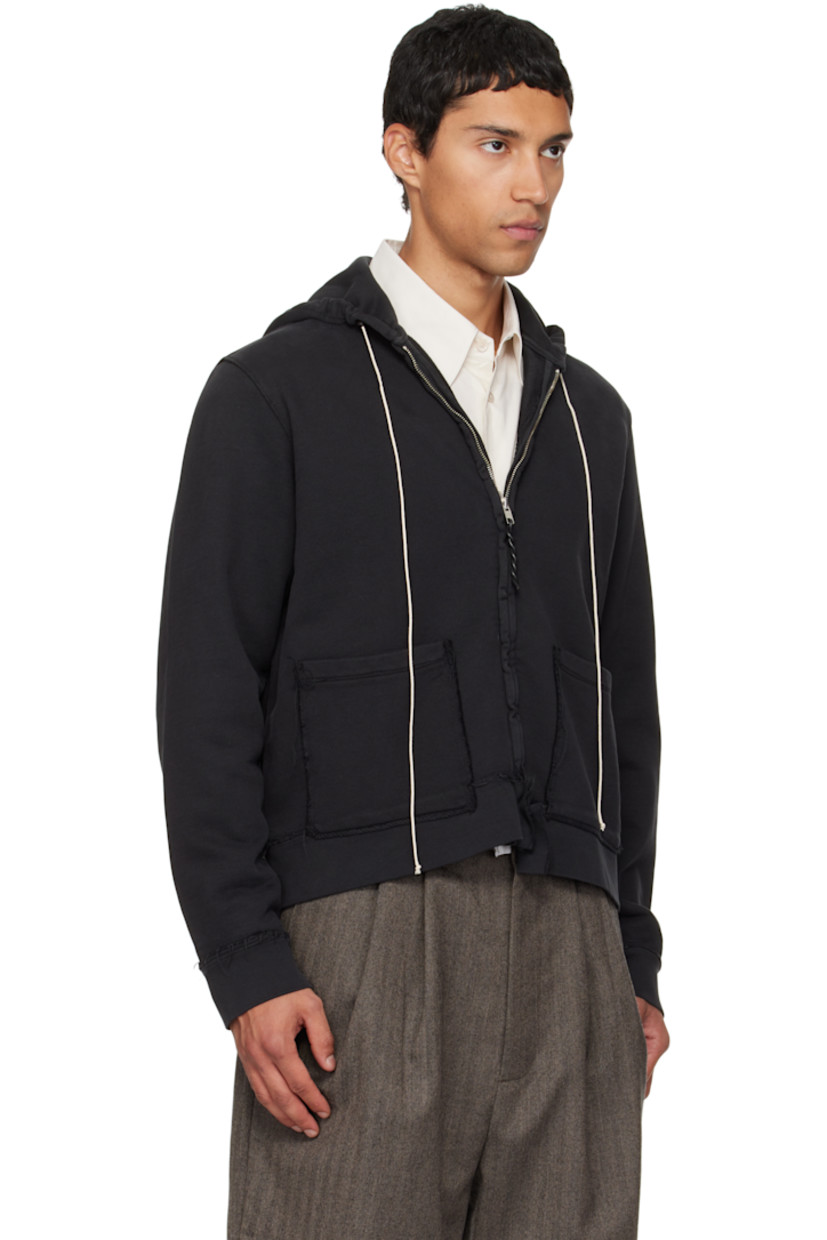 French terry hoodie. 

· Exposed seams and fading throughout 
· Drawstring at hood
· Zip closure
· Patch pockets at waist
· Rib-knit hem and cuffs

Supplier color: Black