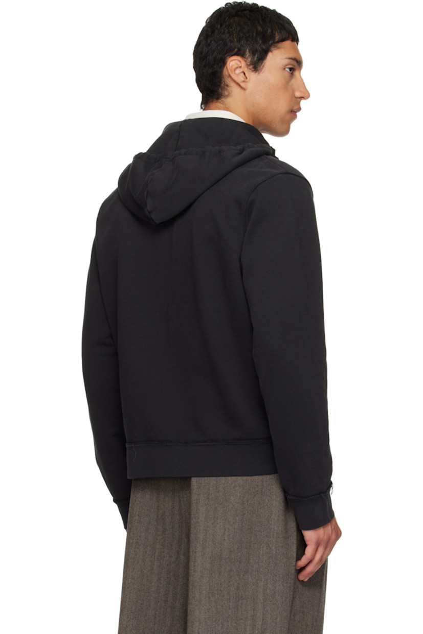 French terry hoodie. 

· Exposed seams and fading throughout 
· Drawstring at hood
· Zip closure
· Patch pockets at waist
· Rib-knit hem and cuffs

Supplier color: Black