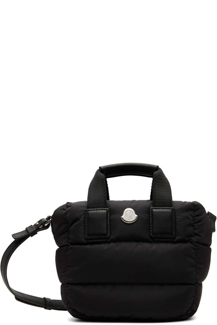Down-filled and quilted nylon taffeta top handle bag.

· DIST-certified down
· Twin carry handles
· Adjustable and detachable leather crossbody strap
· Logo hardware at face
· Zip closure
· Card slot at interior
· H6" x W7" x D4.75"

Supplier color: Black

Fill: 90% goose down, 10% goose feather.
