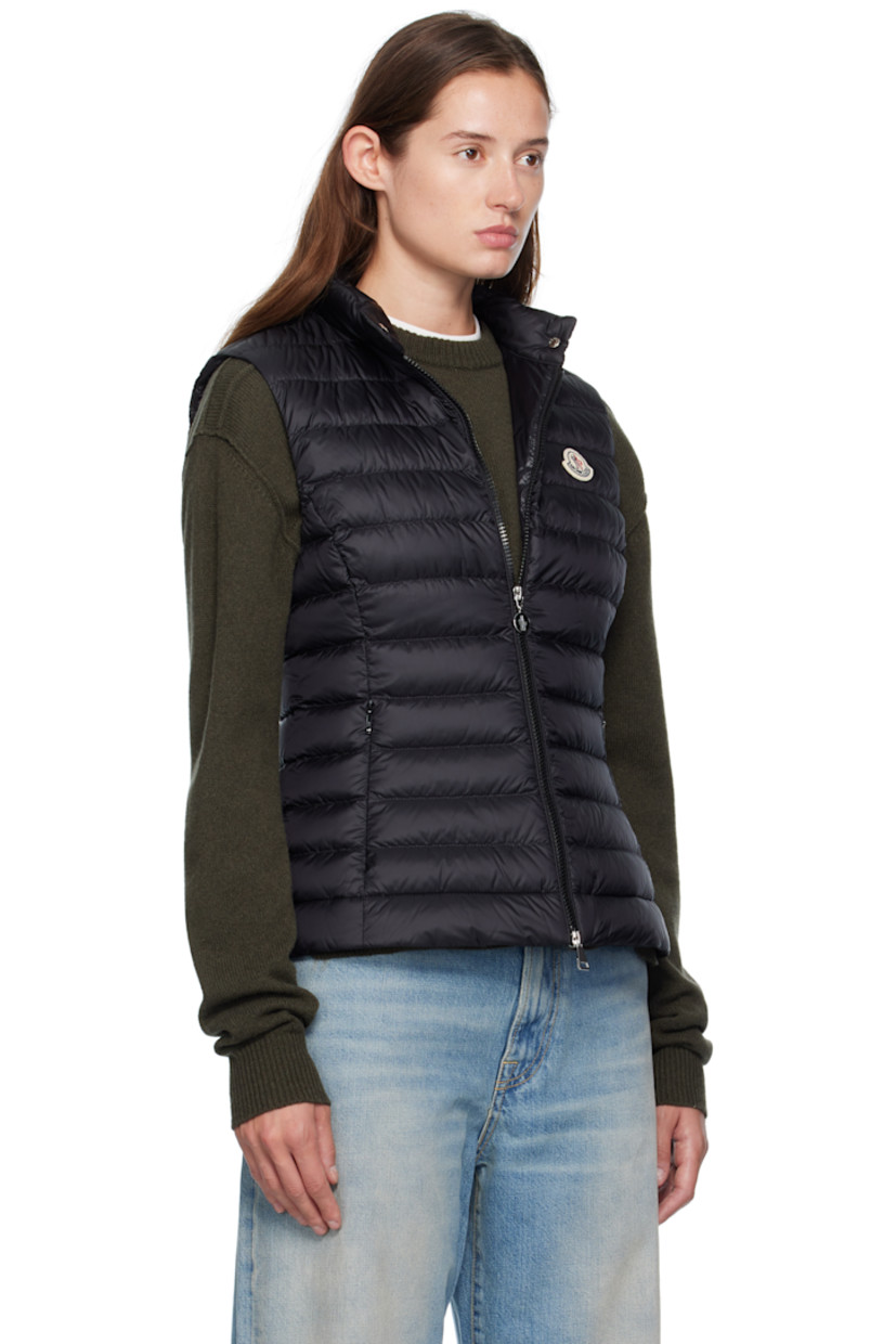Down-filled quilted satin vest.

· DIST-certified down and feathers
· Press-stud tab at stand collar
· Two-way zip closure
· Embroidered logo patch at chest
· Zip pockets at waist

Supplier color: Black

Fill: 90% down, 10% feathers.