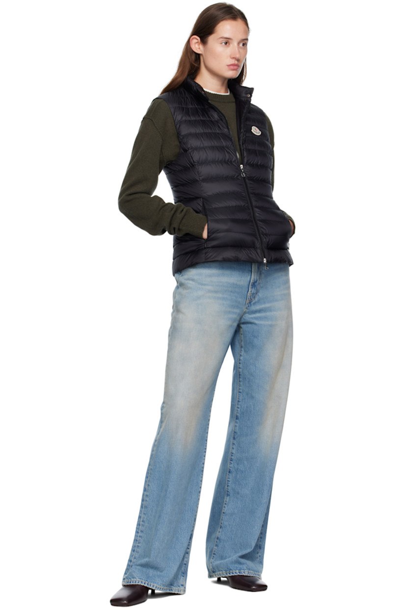 Down-filled quilted satin vest.

· DIST-certified down and feathers
· Press-stud tab at stand collar
· Two-way zip closure
· Embroidered logo patch at chest
· Zip pockets at waist

Supplier color: Black

Fill: 90% down, 10% feathers.