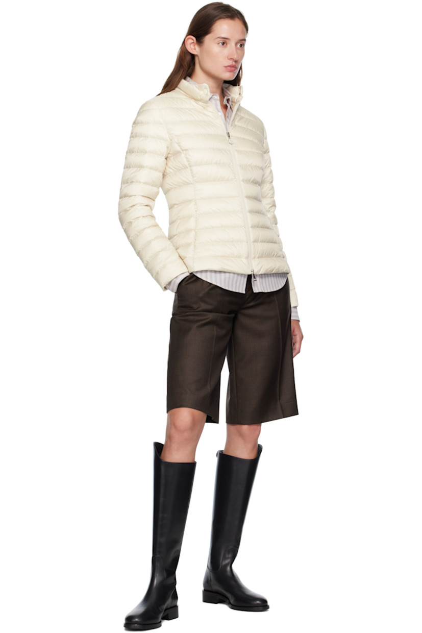 Down-filled and quilted recycled nylon taffeta jacket.

· DIST-certified down
· Press-stud fastening at stand collar
· Two-way zip closure
· Zip seam pockets at waist
· Tricolor felted logo patch at sleeve
· Patch pockets at interior
· Fully lined
· Logo-engraved silver-tone hardware

Supplier color: Beige

Fill 1: 90% goose down, 10% feather. Fill 2: 100% polyester.