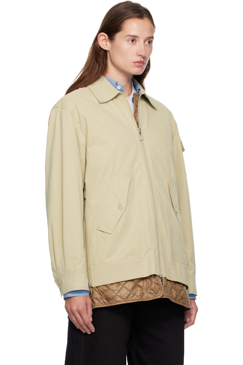 Cotton-blend canvas jacket. 

· Spread collar 
· Two-way zip closure
· Flap pockets at waist
· Zip vent at side seams 
· Utility pocket and tricolor felted logo patch at sleeve
· Pleats at press-stud barrel cuffs
· Strap at back collar 
· Inverted box pleat at back yoke 
· Exposed quilted satin lining 

Supplier color: Sponge