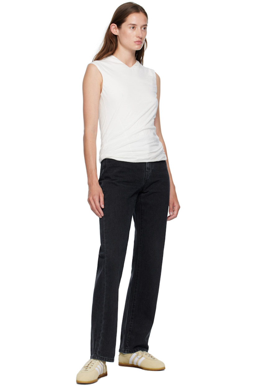 Stonewashed 13.5 oz non-stretch Smith denim jeans.

· Fading and whiskering throughout 
· Straight-leg 
· High-rise
· Belt loops
· Five-pocket styling
· Zip fly 
· Logo patch at back pocket

Supplier color: Black stonewashed