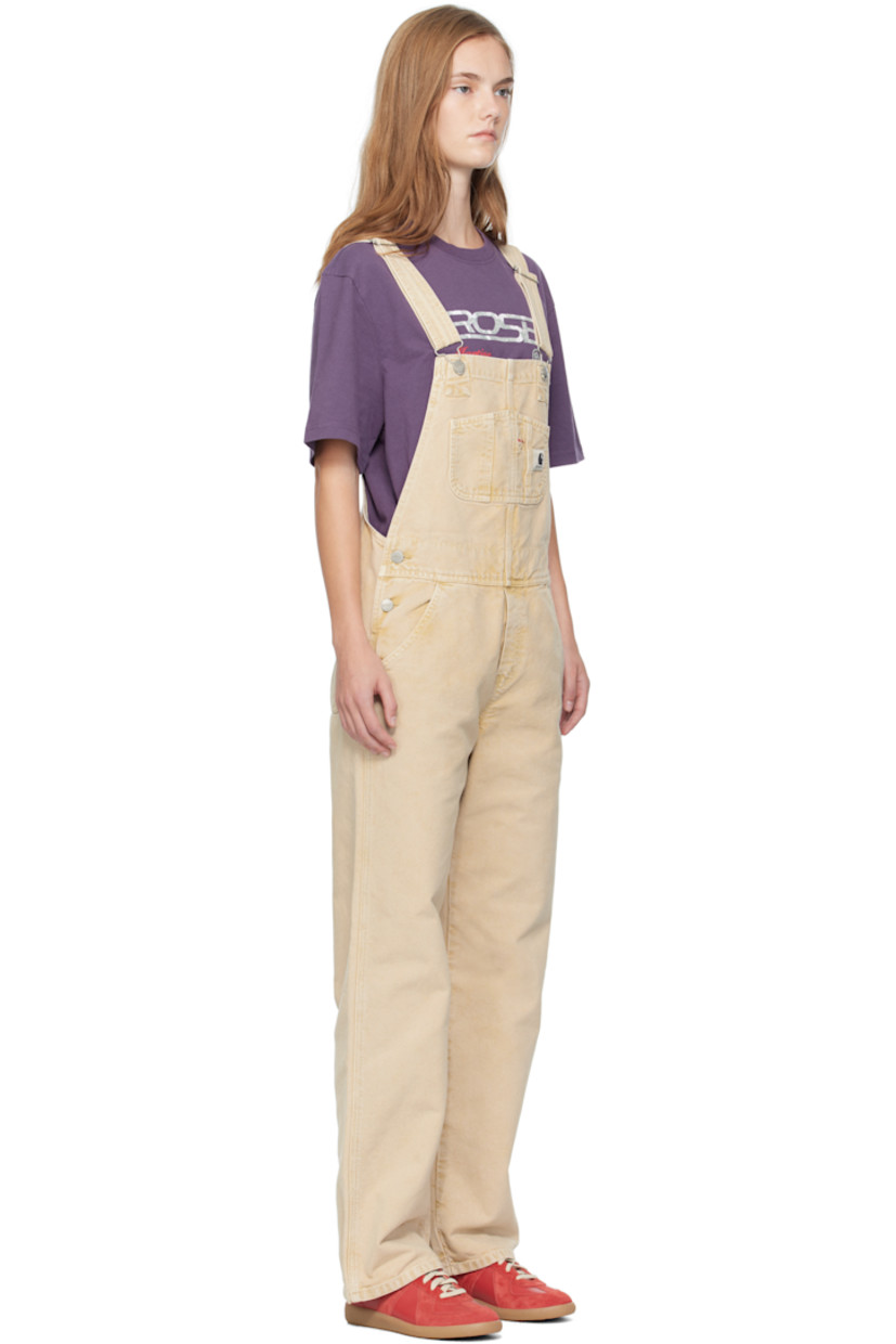 Heavyweight 12 oz organic cotton canvas overalls.

· Fading throughout
· Square neck
· Patch pockets at chest
· Logo patch at chest and back pocket
· Four-pocket styling
· Mock fly
· Button fastening at sides
· Adjustable shoulder straps

Supplier color: Dusty Hamilton brown (chalk wash)