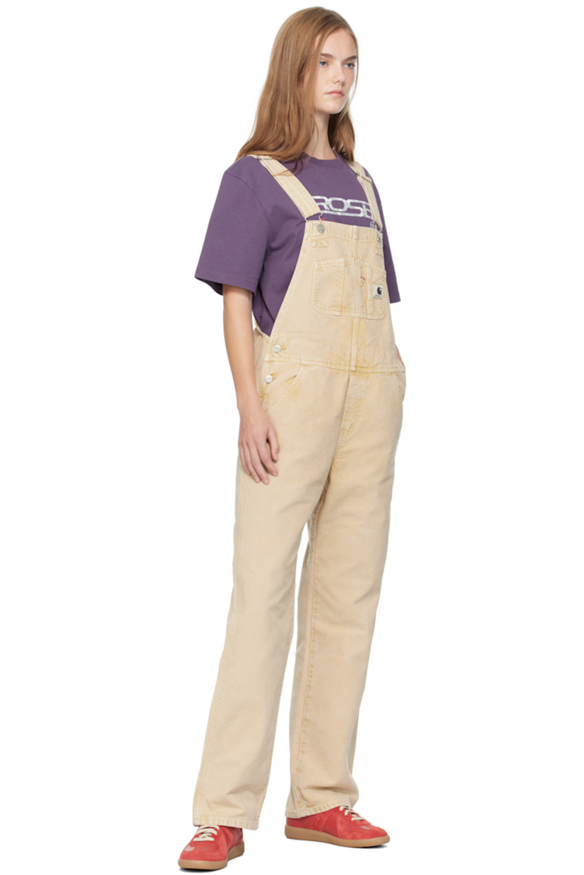 Heavyweight 12 oz organic cotton canvas overalls.

· Fading throughout
· Square neck
· Patch pockets at chest
· Logo patch at chest and back pocket
· Four-pocket styling
· Mock fly
· Button fastening at sides
· Adjustable shoulder straps

Supplier color: Dusty Hamilton brown (chalk wash)