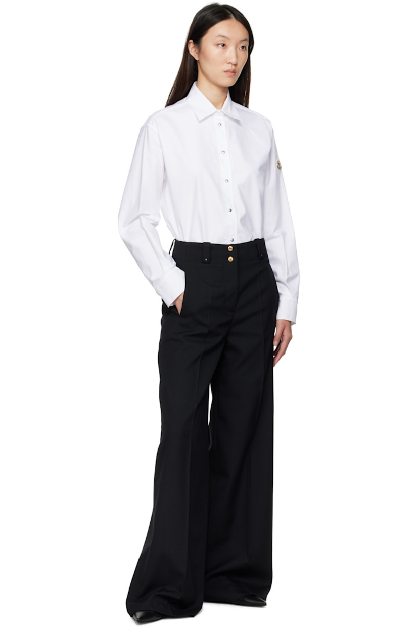 Polyester- and virgin wool-blend cavalry twill trousers.

· Belt loops
· Logo hardware at front belt loops
· Four-pocket styling
· Zip fly
· Creased legs
· Embroidered logo patch at back
· Logo-engraved gold-tone hardware

Supplier color: Black