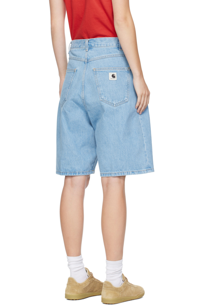 13.5 oz non-stretch denim shorts.

· Fading throughout
· Mid-rise
· Belt loops
· Five-pocket styling
· Zip fly
· Logo patch at back pocket
· Contrast stitching in tan

Supplier color: Blue (stone bleached)