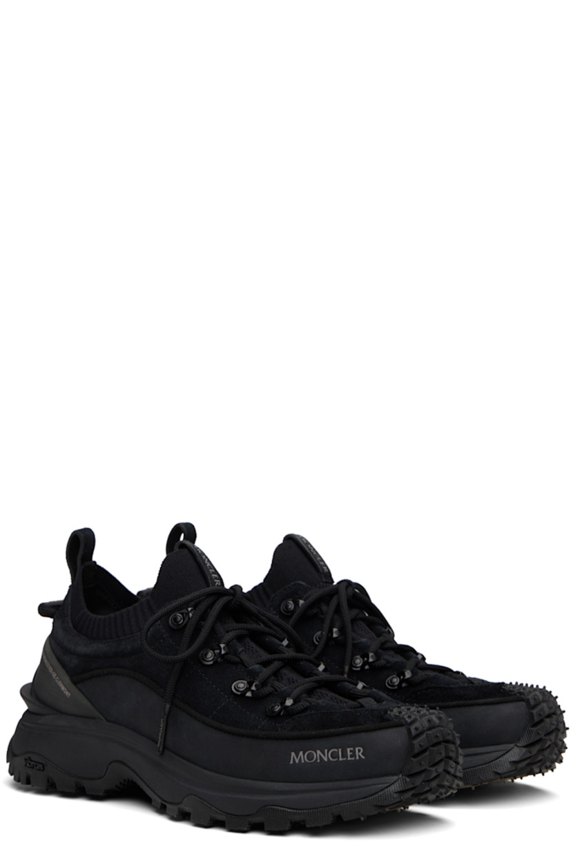 Low-top suede and nubuck sneakers in black.

· Logo printed at toe
· Lace-up closure
· Logo-printed pull-loop at tongue
· Rib-knit trim at padded collar
· Pull-loops at heel tab
· Textured logo-embossed rubber trim at heel counter
· Mesh lining
· Foam rubber midsole
· Treaded Vibram® Megagrip rubber sole

Supplier color: Black