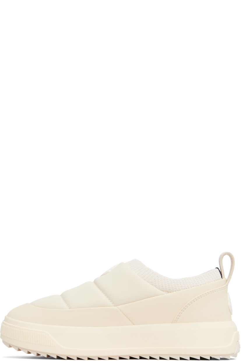 Low-top padded jersey and canvas slip-on sneakers.

· Rubberized logo patch at vamp and heel counter
· Rib-knit collar
· Pull-loop at heel collar
· Ortholite® insole
· Mesh lining
· Logo embossed at foam rubber midsole
· Treaded Vibram® Megagrip rubber sole

Supplier color: Light beige