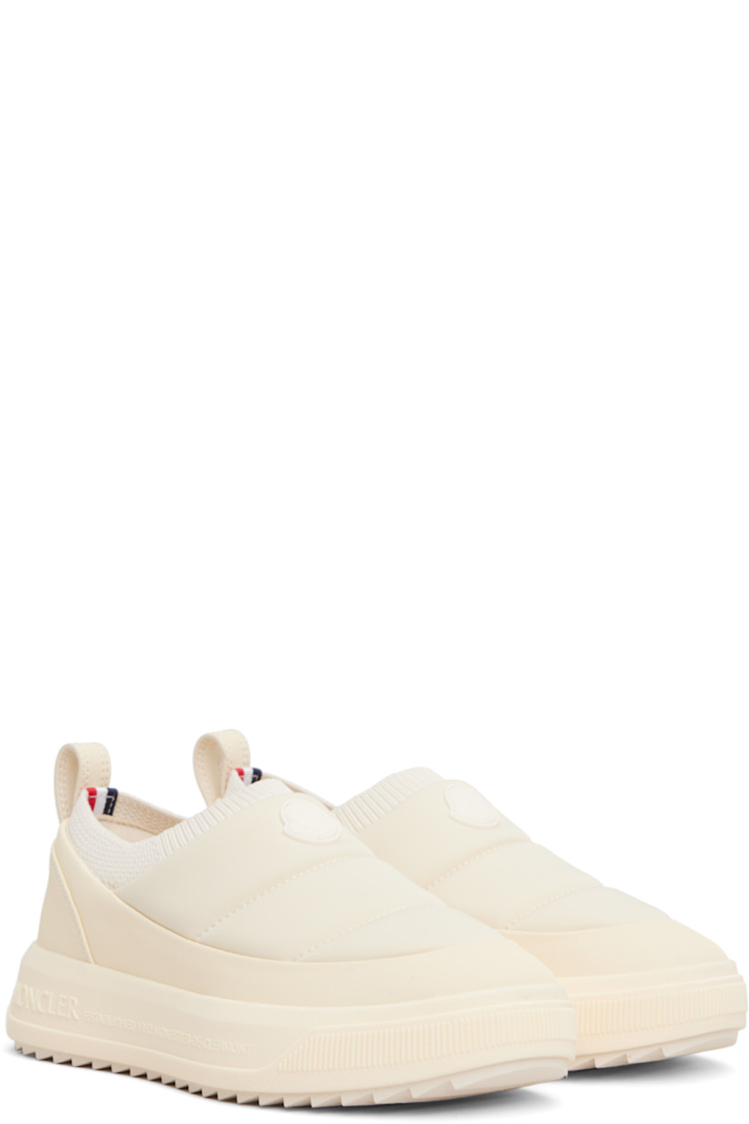 Low-top padded jersey and canvas slip-on sneakers.

· Rubberized logo patch at vamp and heel counter
· Rib-knit collar
· Pull-loop at heel collar
· Ortholite® insole
· Mesh lining
· Logo embossed at foam rubber midsole
· Treaded Vibram® Megagrip rubber sole

Supplier color: Light beige