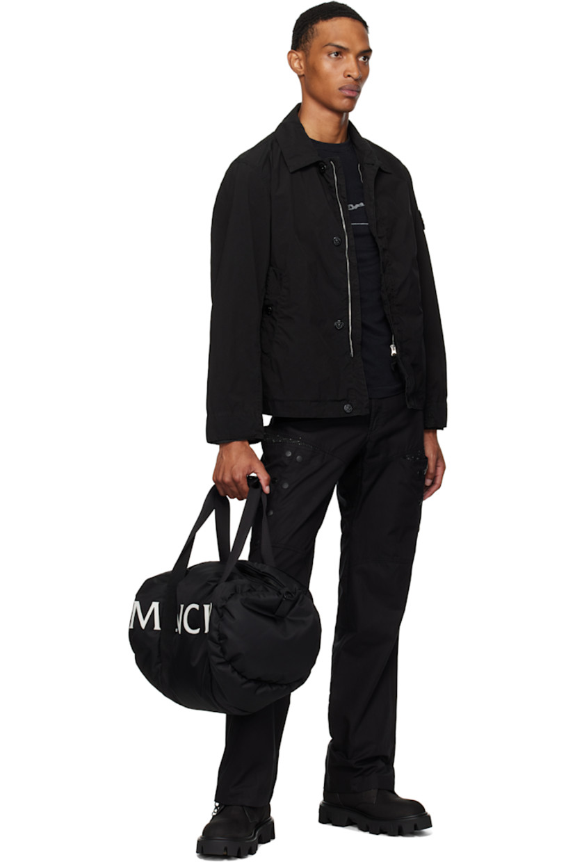Down-filled nylon taffeta duffle bag.

· DIST-certified down
· Press-stud leather tab at carry handles
· Adjustable and detachable crossbody strap
· Logo bonded at face
· Zip closure
· Logo-engraved black hardware
· H8" x W20" x D10"

Supplier color: Black

Fill: 90% goose down, 10% goose feather.