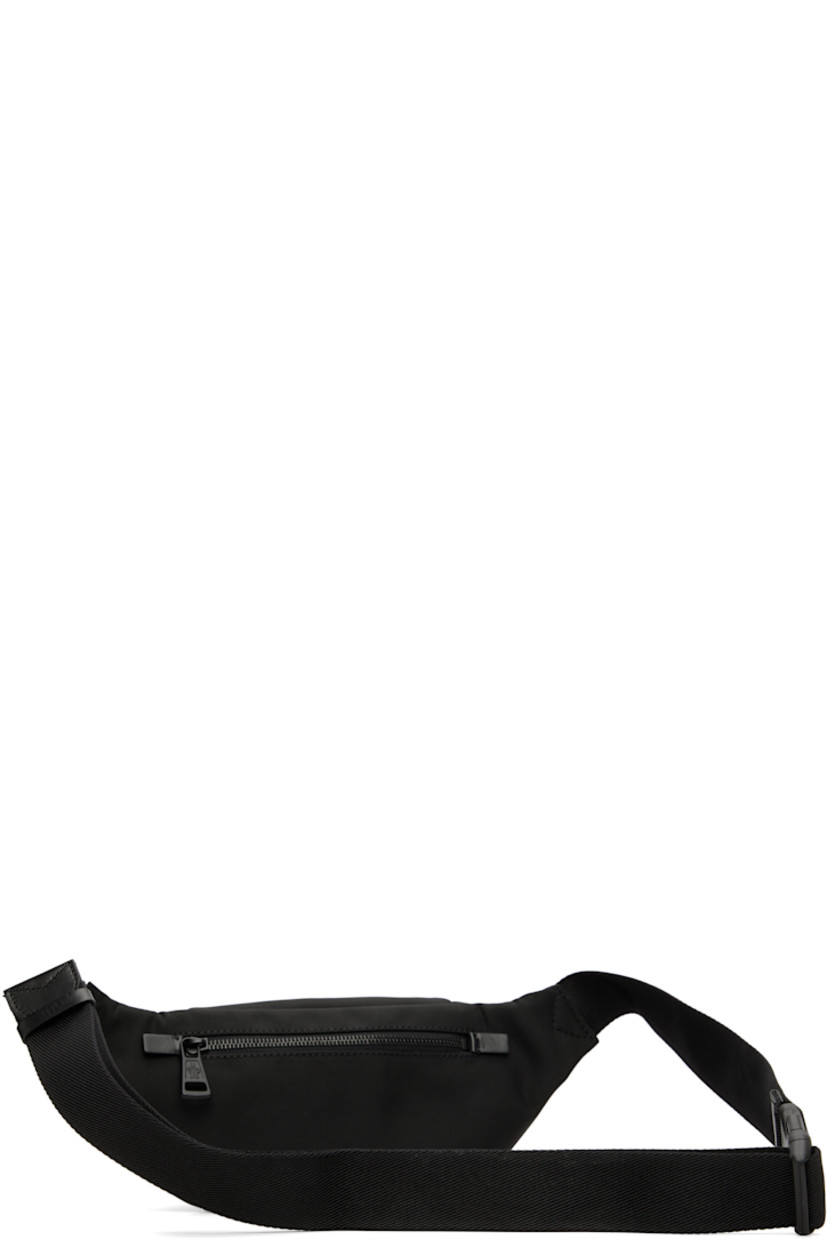 Nylon-blend canvas belt bag.

· Water-repellent
· Adjustable press-release belt-style strap
· D-ring at strap
· Logo hardware at face
· Zip pocket at back face
· Zip closure
· H5" x W13" x D2.5"

Supplier color: Black