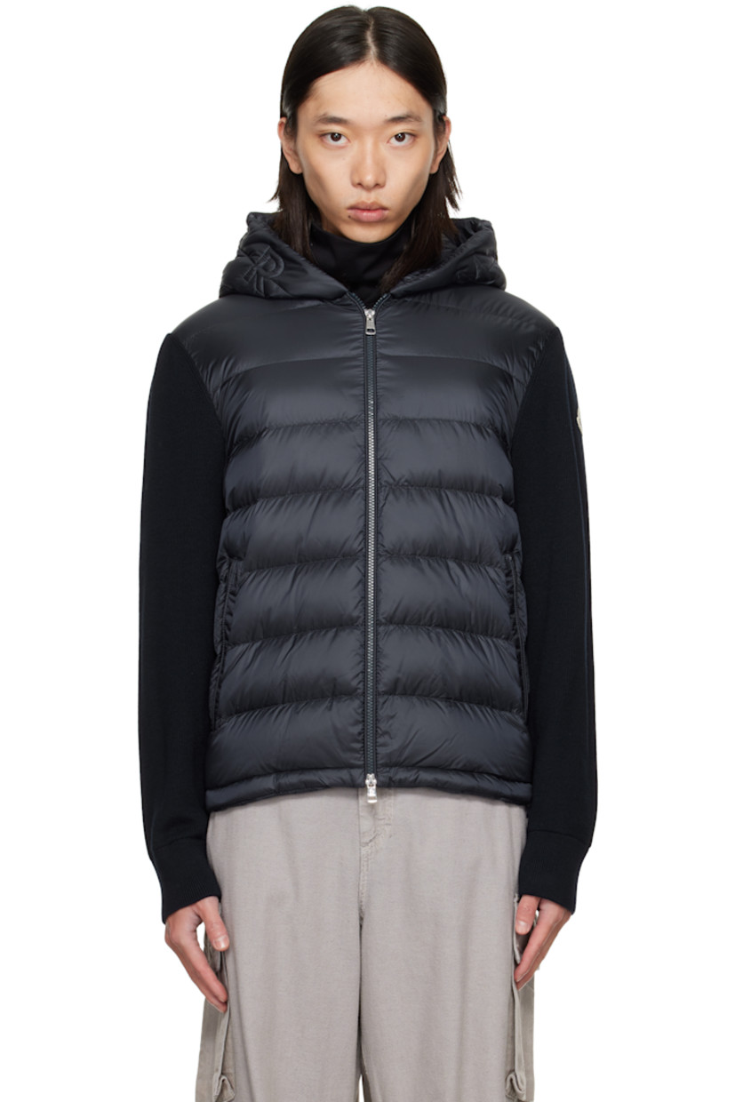 Double-faced knit wool hoodie. 

· Quilted down-filled satin front and hood
· DIST-certified down and feathers
· Two-way zip closure
· Zip pockets at waist
· Embroidered logo patch at sleeve
· Rib-knit cuffs
· Unlined

Supplier color: Obsidian Blue

Fill: 90% down, 10% feathers.