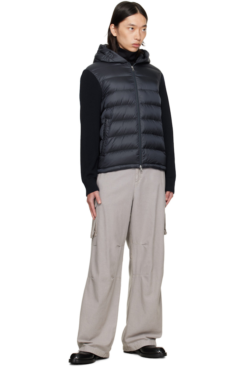 Double-faced knit wool hoodie. 

· Quilted down-filled satin front and hood
· DIST-certified down and feathers
· Two-way zip closure
· Zip pockets at waist
· Embroidered logo patch at sleeve
· Rib-knit cuffs
· Unlined

Supplier color: Obsidian Blue

Fill: 90% down, 10% feathers.