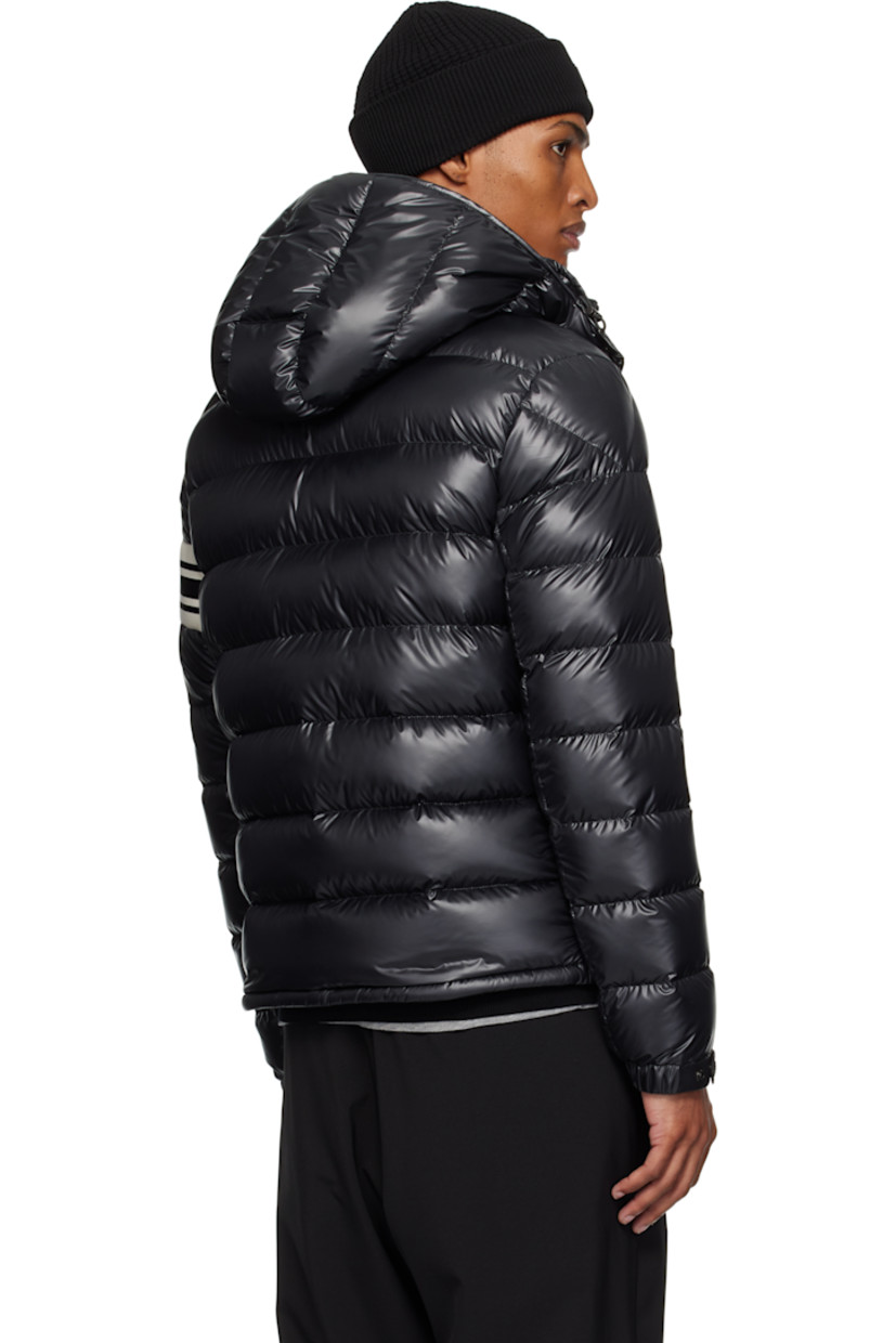 Down-filled and quilted polyester satin jacket.

· DIST-certified down
· Bungee-style drawstring at detachable hood
· Stand collar
· Two-way zip closure
· Zip pockets
· Bungee-style drawstring at hem
· Knit striped panel and felted logo patch at sleeve
· Elasticized cuffs
· Fully lined

Supplier color: Black

Fill: 90% goose down, 10% feather.