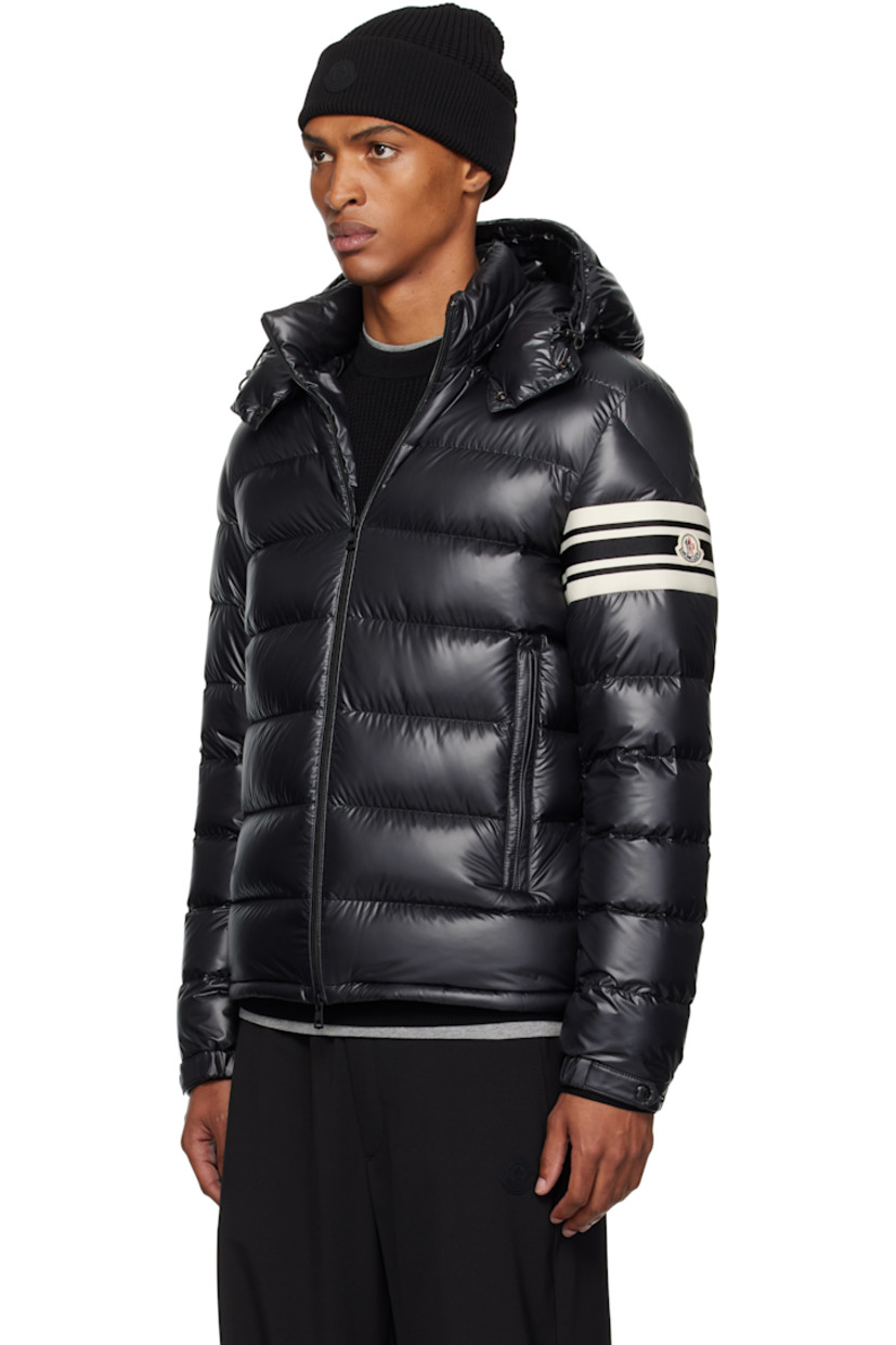 Down-filled and quilted polyester satin jacket.

· DIST-certified down
· Bungee-style drawstring at detachable hood
· Stand collar
· Two-way zip closure
· Zip pockets
· Bungee-style drawstring at hem
· Knit striped panel and felted logo patch at sleeve
· Elasticized cuffs
· Fully lined

Supplier color: Black

Fill: 90% goose down, 10% feather.