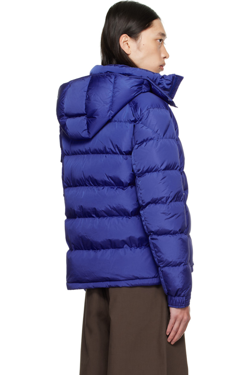 Down-filled quilted nylon satin jacket.

· DIST-certified down and feathers
· Bungee-style drawstring at detachable hood
· Funnel neck
· Two-way zip closure
· Zip pockets at waist
· Bungee-style drawstring at hem
· Flap pocket with embroidered logo at sleeve
· Adjustable press-stud tab at elasticized cuffs
· Zip pocket at interior
· Fully lined

Supplier color: Sodalite blue

Fill: 90% down, 10% feather.