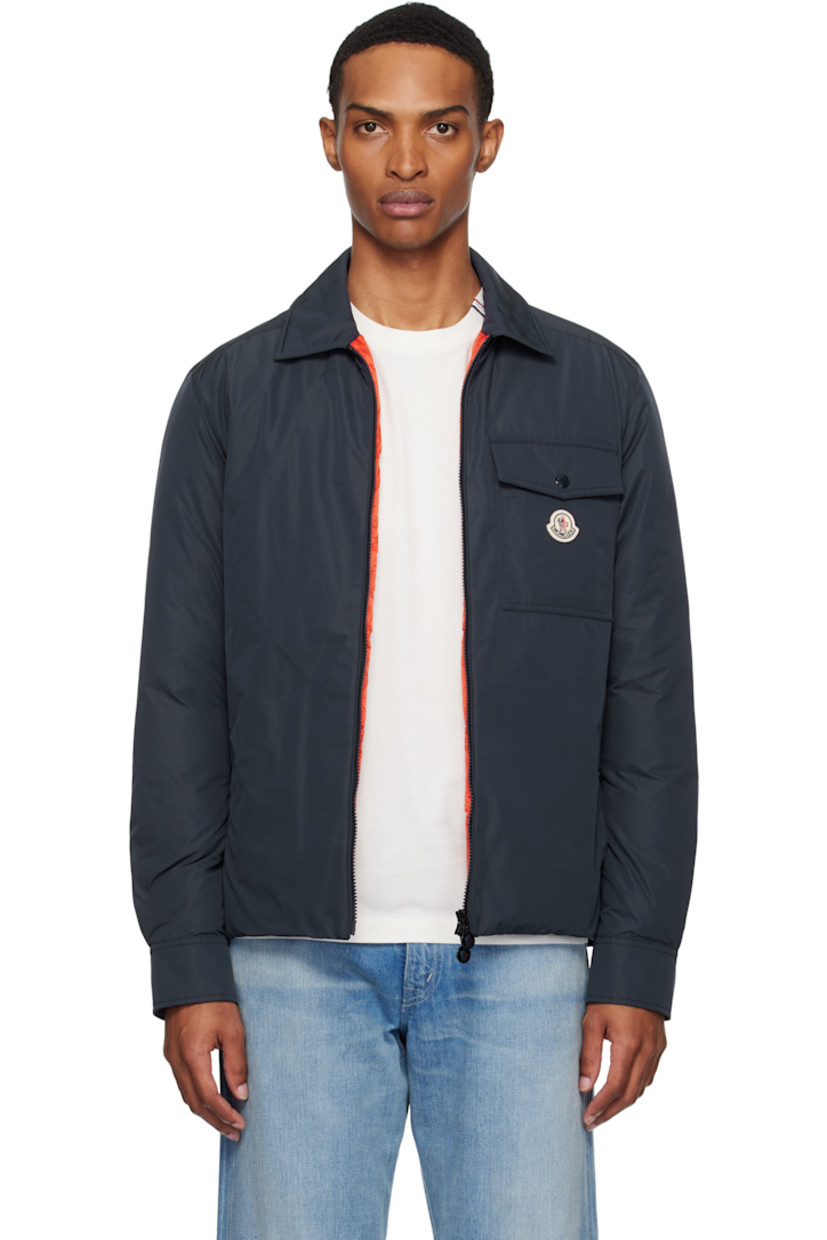 Down-filled polyester taffeta jacket.

· DIST-certified down
· Spread collar
· Two-way zip closure
· Flap pocket and felted logo patch at chest
· Welt pockets
· Press-stud barrel cuffs
· Zip pocket at interior
· Full quilted satin lining

Supplier color: English blue 

Fill: 90% goose down, 10% feather.