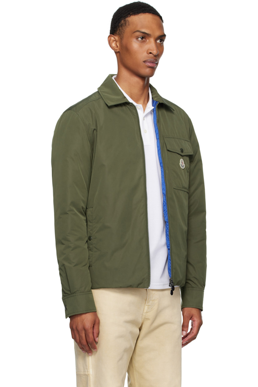 Down-filled polyester taffeta jacket.

· DIST-certified down
· Spread collar
· Two-way zip closure
· Flap pocket and felted logo patch at chest
· Welt pockets
· Press-stud barrel cuffs
· Zip pocket at interior
· Full quilted satin lining

Supplier color: Deep depths

Fill: 90% goose down, 10% feather.