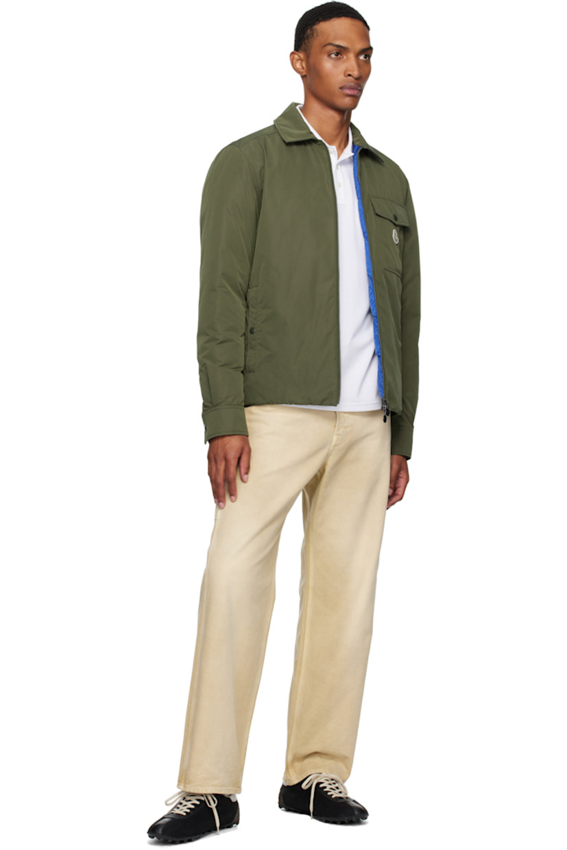 Down-filled polyester taffeta jacket.

· DIST-certified down
· Spread collar
· Two-way zip closure
· Flap pocket and felted logo patch at chest
· Welt pockets
· Press-stud barrel cuffs
· Zip pocket at interior
· Full quilted satin lining

Supplier color: Deep depths

Fill: 90% goose down, 10% feather.