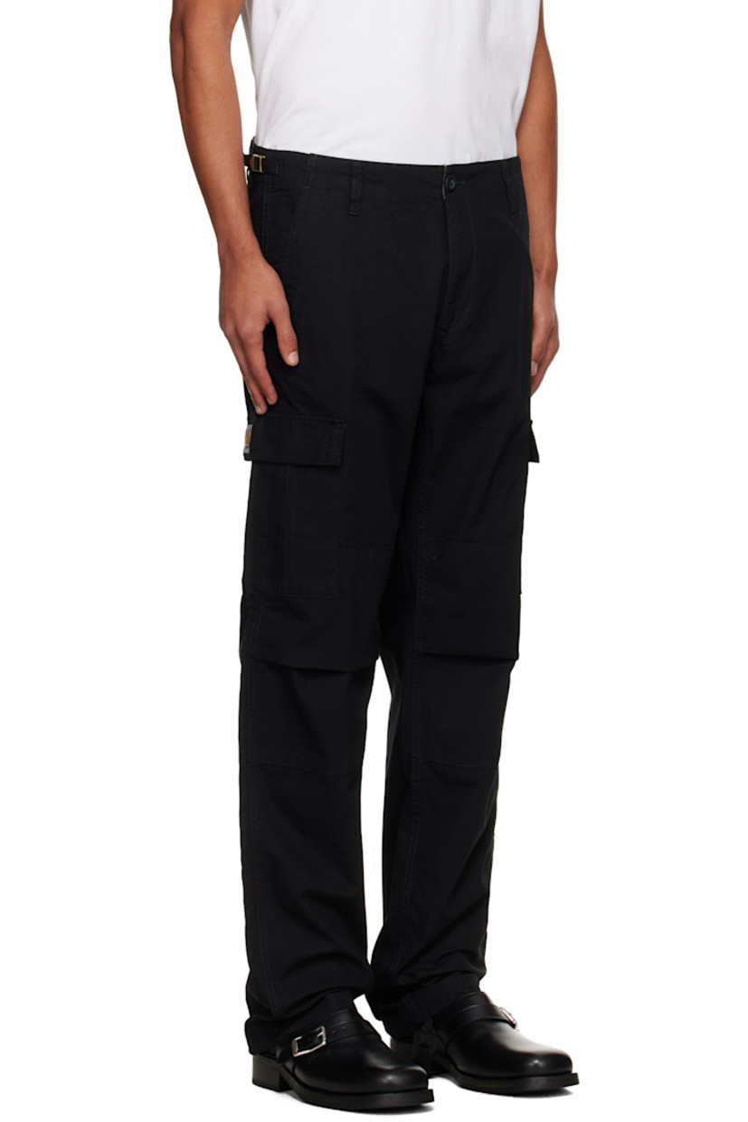 Cotton ripstop cargo pants.

· Slim-fit
· Low-rise
· Belt loops and cinch tabs at waistband
· Four-pocket styling
· Zip fly
· Pleat at knees
· Drawstring at cuffs
· Cargo pocket at outseams
· Logo patch at cargo pocket

Supplier color: Black