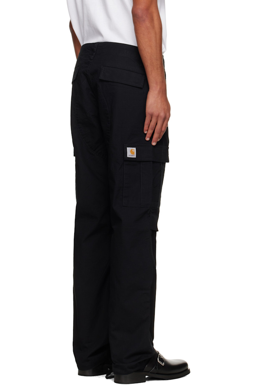Cotton ripstop cargo pants.

· Slim-fit
· Low-rise
· Belt loops and cinch tabs at waistband
· Four-pocket styling
· Zip fly
· Pleat at knees
· Drawstring at cuffs
· Cargo pocket at outseams
· Logo patch at cargo pocket

Supplier color: Black