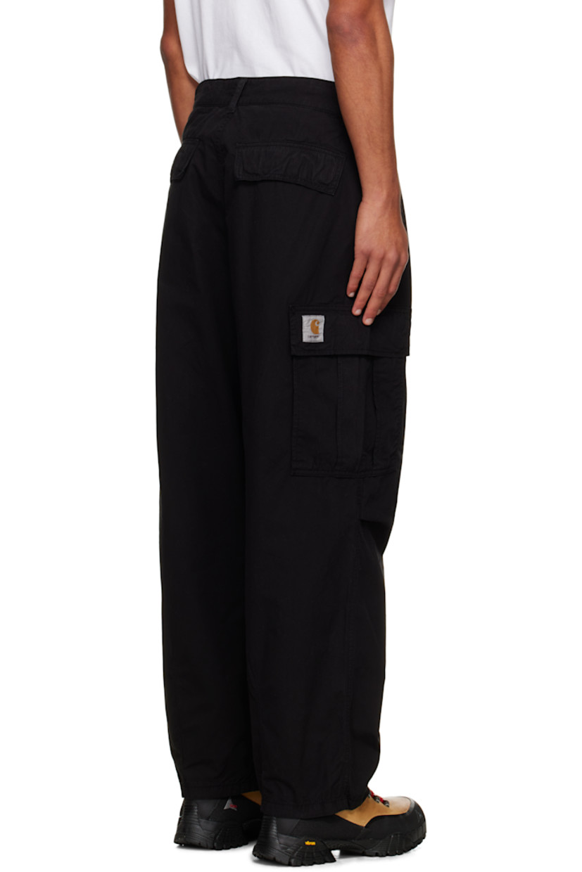 Garment-dyed cotton twill cargo pants.

· Loose-fit
· Belt loops
· Four-pocket styling
· Zip fly
· Pleats at knees
· Dropped inseam
· Cargo pocket at outseams
· Logo patch at back pocket

Supplier color: Black