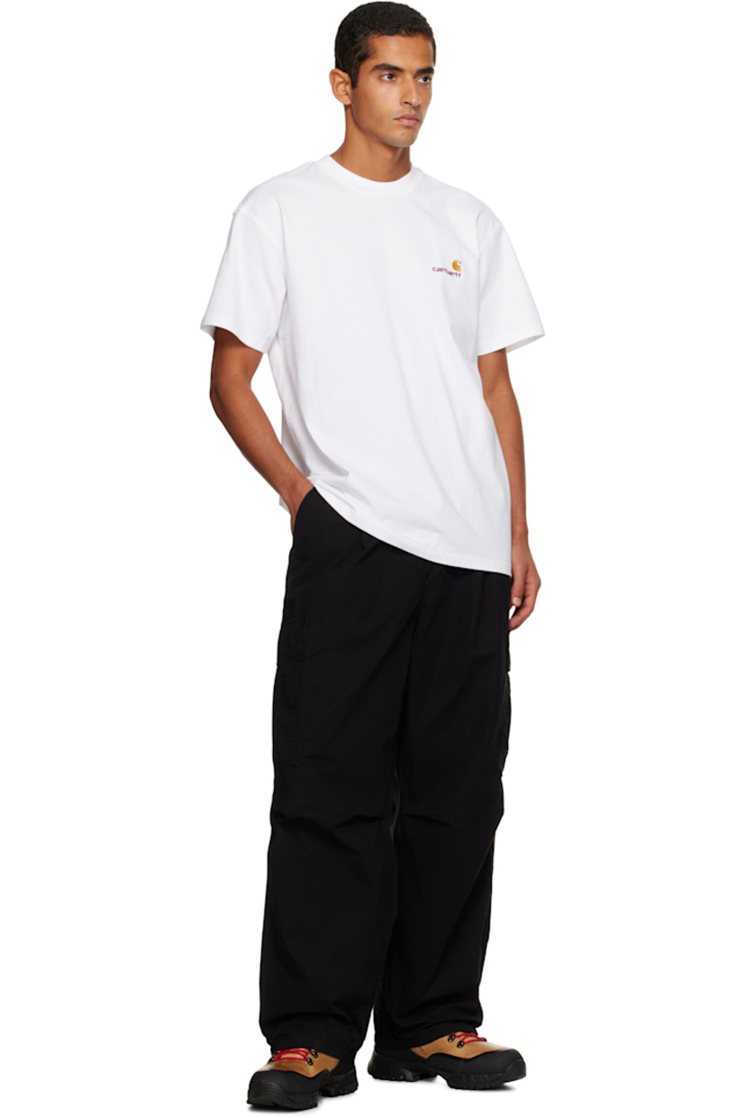 Garment-dyed cotton twill cargo pants.

· Loose-fit
· Belt loops
· Four-pocket styling
· Zip fly
· Pleats at knees
· Dropped inseam
· Cargo pocket at outseams
· Logo patch at back pocket

Supplier color: Black