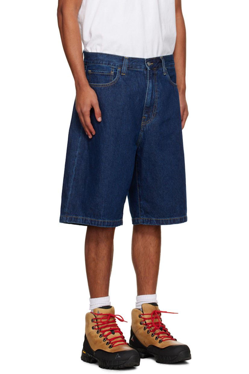 Stonewashed heavyweight 12 oz non-stretch denim shorts.

· Fading throughout
· Loose-fit
· Mid-rise
· Belt loops
· Five-pocket styling
· Zip fly
· Logo patch at back pocket
· Contrast stitching in tan

Supplier color: Blue (Stone Washed)
