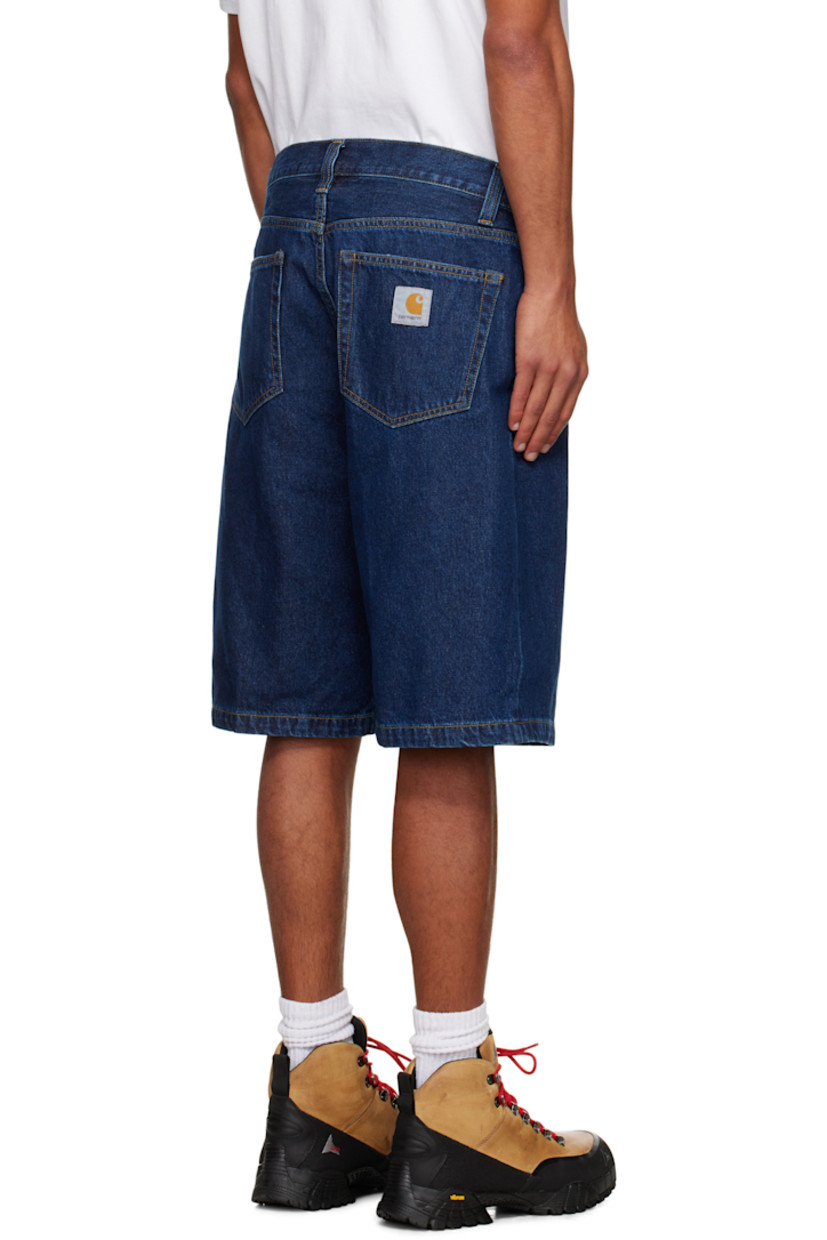 Stonewashed heavyweight 12 oz non-stretch denim shorts.

· Fading throughout
· Loose-fit
· Mid-rise
· Belt loops
· Five-pocket styling
· Zip fly
· Logo patch at back pocket
· Contrast stitching in tan

Supplier color: Blue (Stone Washed)