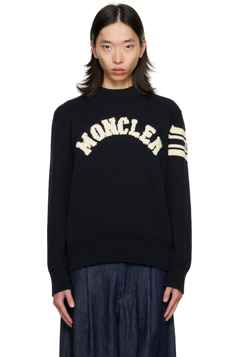 Knit cotton sweater. 

· Rib-knit crewneck, hem, and cuffs
· Bouclé logo appliqués at chest
· Tricolor felted logo patch and jacquard stripes at sleeve

Supplier color: Obsidian blue