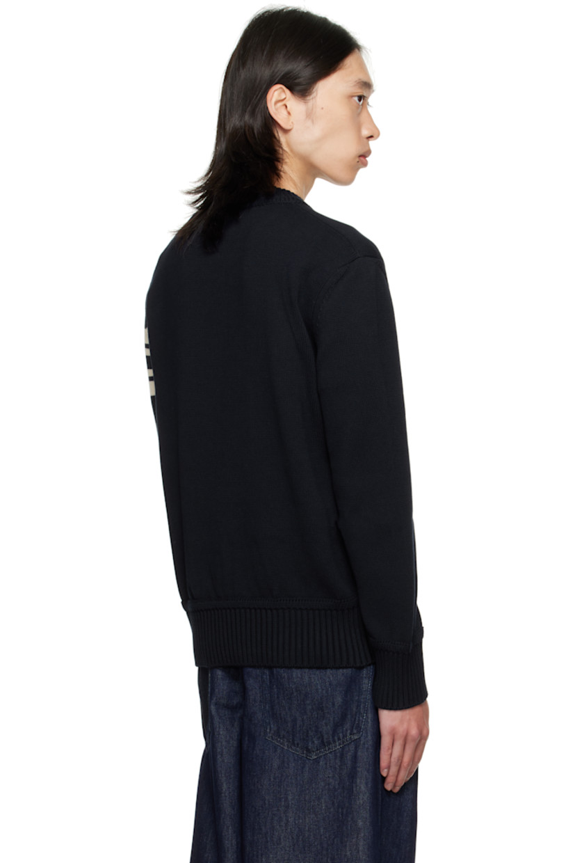 Knit cotton sweater. 

· Rib-knit crewneck, hem, and cuffs
· Bouclé logo appliqués at chest
· Tricolor felted logo patch and jacquard stripes at sleeve

Supplier color: Obsidian blue