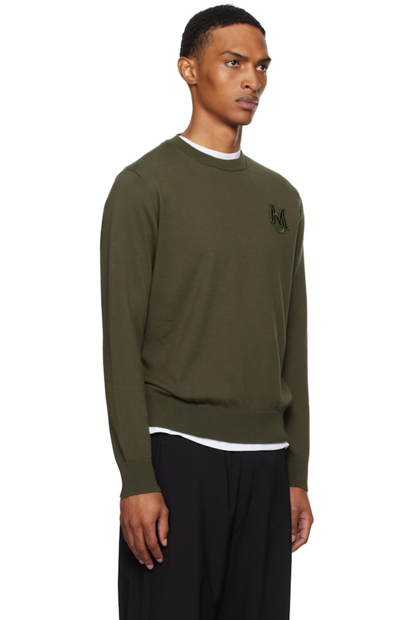 12-gauge knit cotton sweater.

· Lightweight
· Rib-knit crewneck, hem, and cuffs
· Embroidered logo patch at chest
· Felted logo patch at sleeve

Supplier color: Deep depths