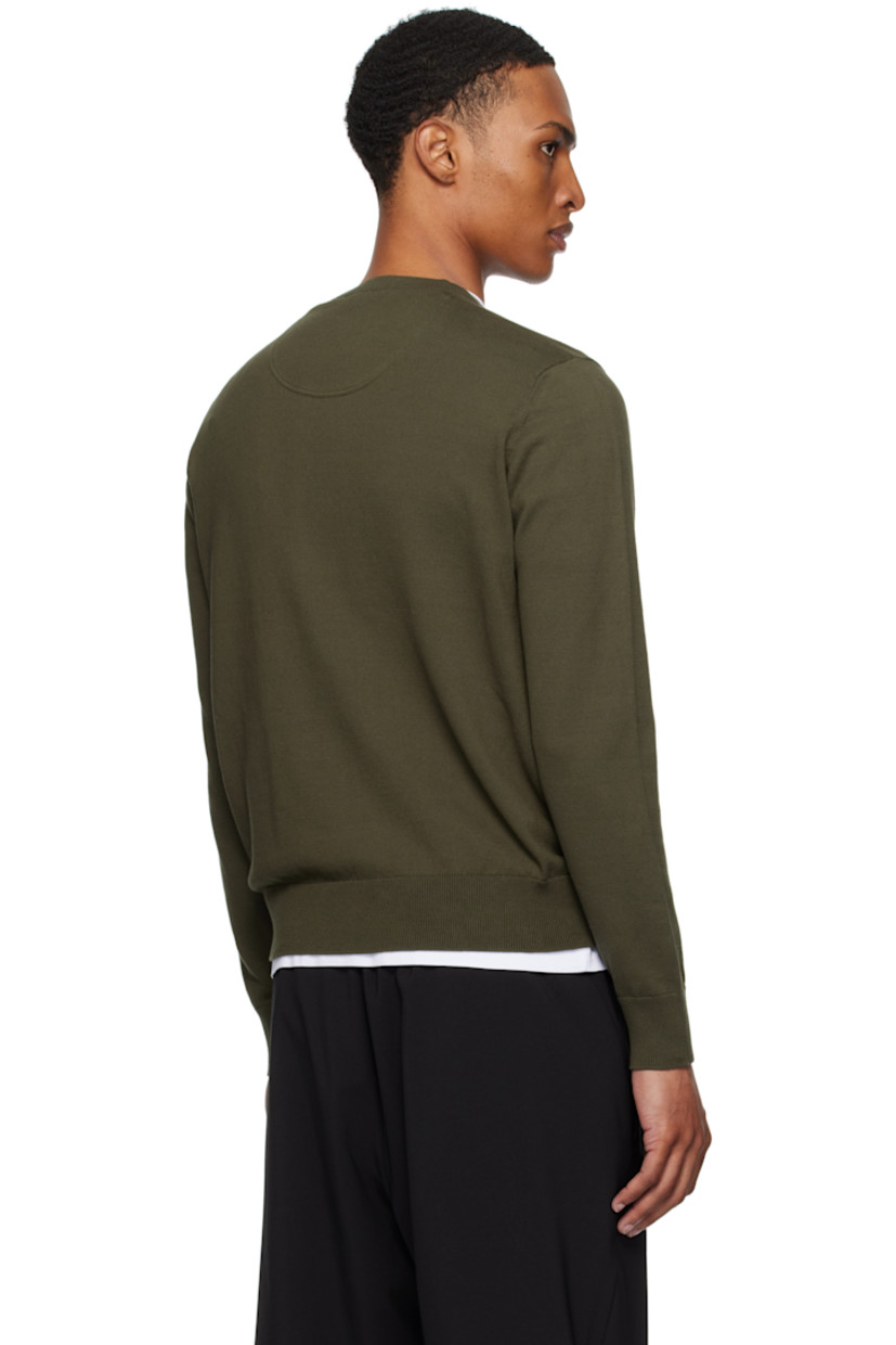 12-gauge knit cotton sweater.

· Lightweight
· Rib-knit crewneck, hem, and cuffs
· Embroidered logo patch at chest
· Felted logo patch at sleeve

Supplier color: Deep depths
