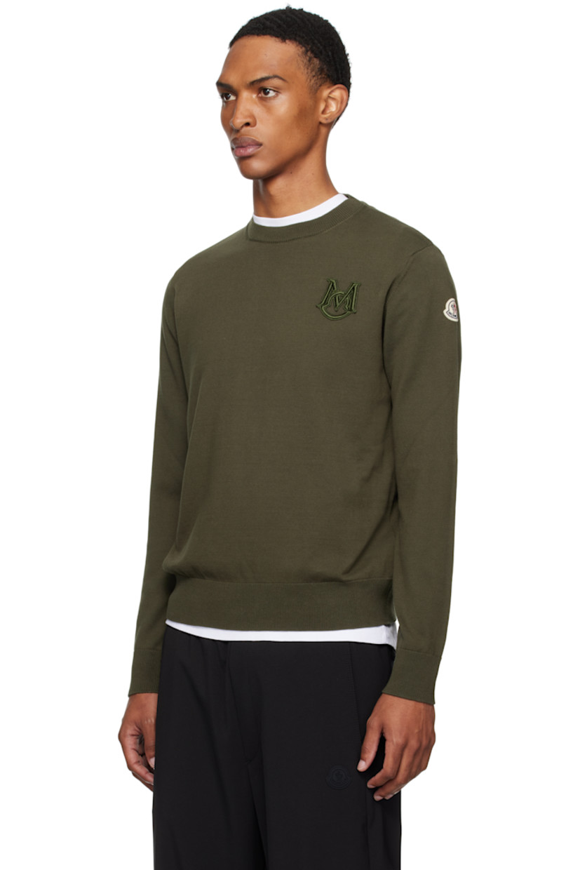 12-gauge knit cotton sweater.

· Lightweight
· Rib-knit crewneck, hem, and cuffs
· Embroidered logo patch at chest
· Felted logo patch at sleeve

Supplier color: Deep depths