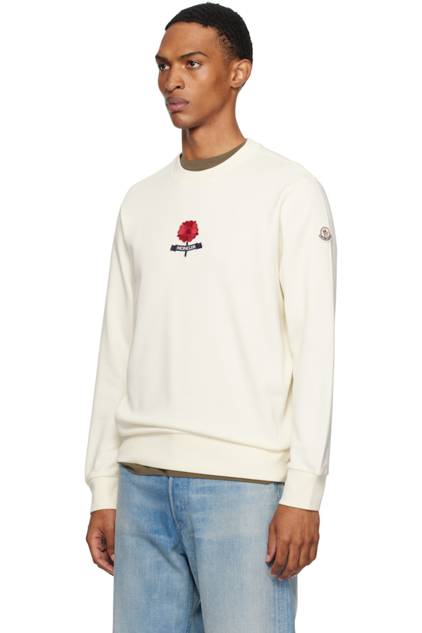 French terry sweatshirt.

· Rib-knit crewneck, hem, and cuffs
· Logo graphic embroidered at chest
· Felted logo patch at sleeve

Supplier color: Antique white