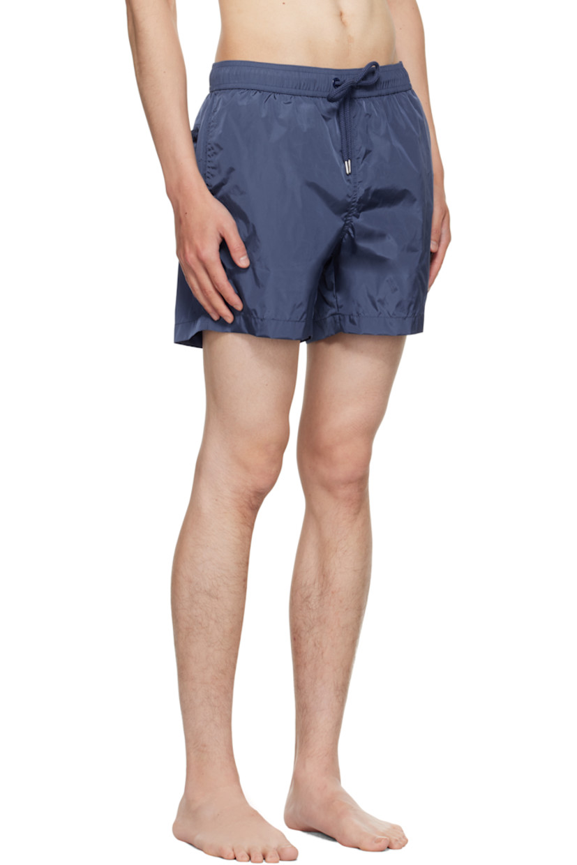 Nylon taffeta swim shorts.

· Drawstring at elasticized waistband
· Three-pocket styling
· Felted logo patch at front cuff
· Briefs-style mesh lining

Supplier color: Navy