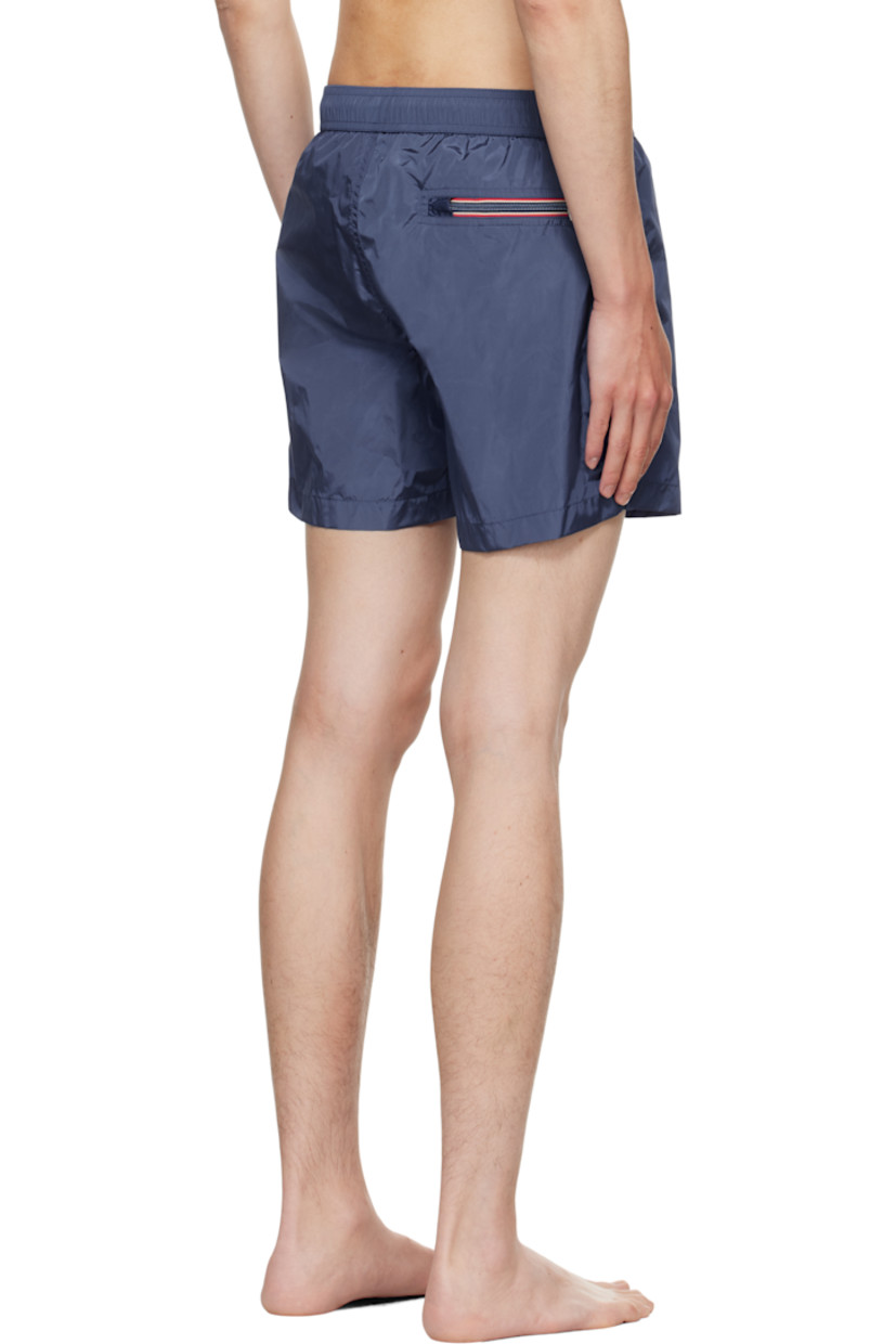 Nylon taffeta swim shorts.

· Drawstring at elasticized waistband
· Three-pocket styling
· Felted logo patch at front cuff
· Briefs-style mesh lining

Supplier color: Navy