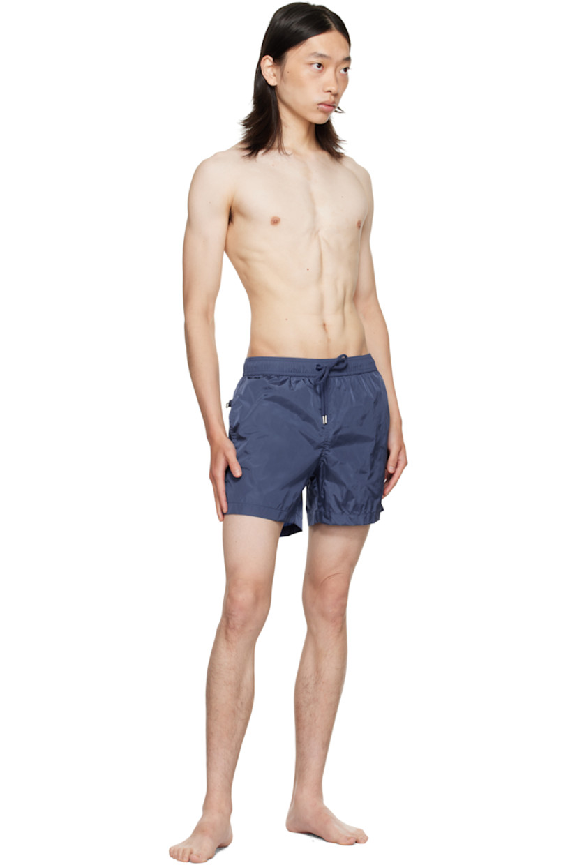 Nylon taffeta swim shorts.

· Drawstring at elasticized waistband
· Three-pocket styling
· Felted logo patch at front cuff
· Briefs-style mesh lining

Supplier color: Navy