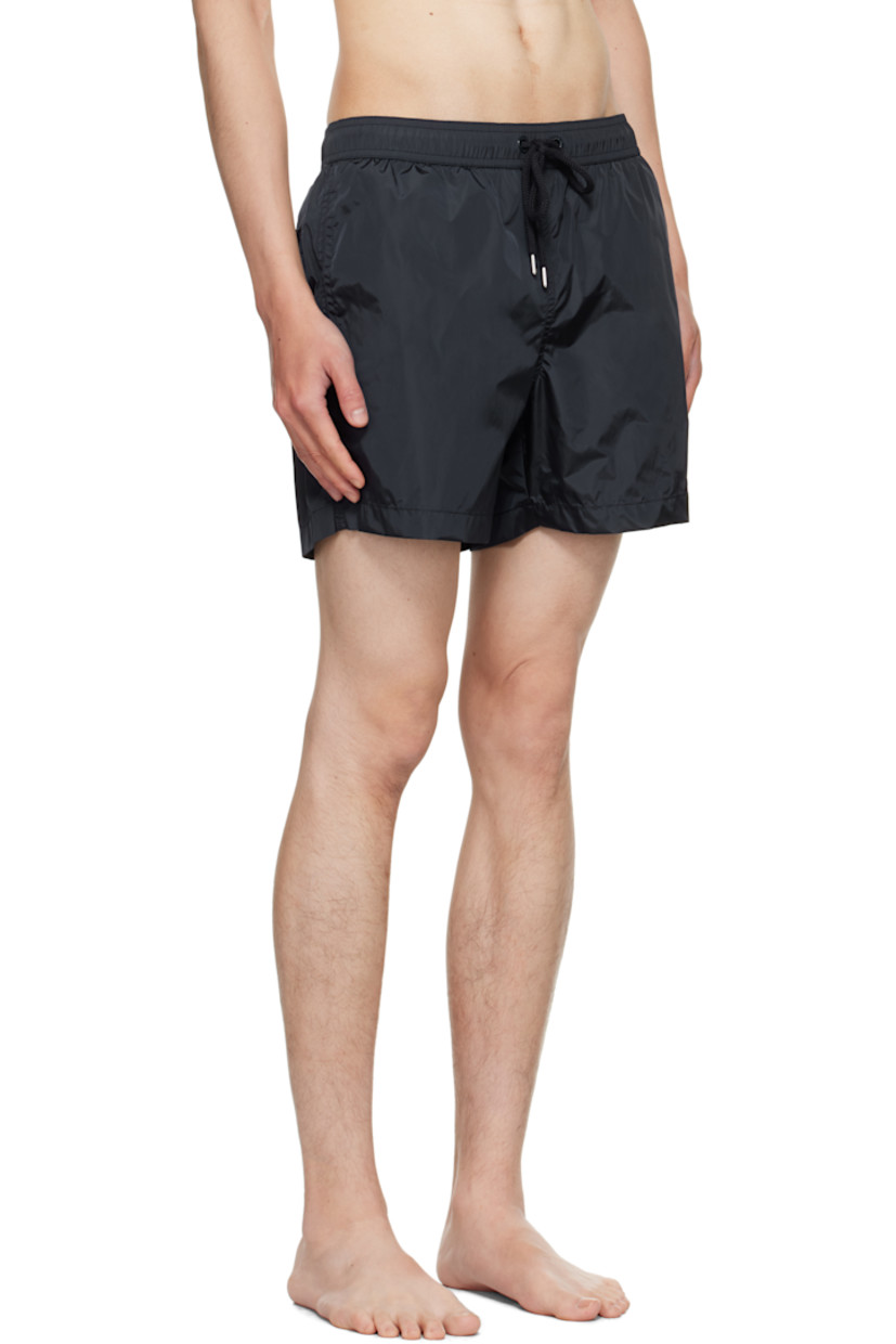 Nylon taffeta swim shorts.

· Drawstring at elasticized waistband
· Three-pocket styling
· Felted logo patch at front cuff
· Briefs-style mesh lining

Supplier color: Blue