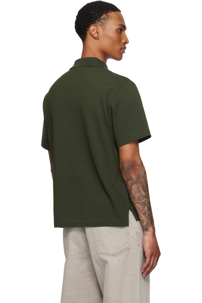 Organic cotton piqué polo.

· Rib-knit spread collar
· Concealed two-button placket
· Logo embroidered at chest
· Tennis-tail hem
· Logo patch at sleeve

Supplier color: Dark ripe olive