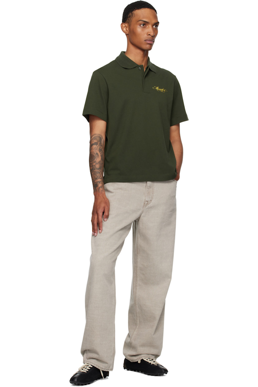 Organic cotton piqué polo.

· Rib-knit spread collar
· Concealed two-button placket
· Logo embroidered at chest
· Tennis-tail hem
· Logo patch at sleeve

Supplier color: Dark ripe olive