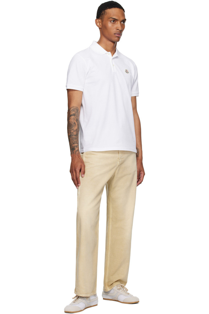 Cotton piqué polo.

· Rib-knit spread collar and cuffs
· Three-button placket
· Felted logo patch at chest
· Mother-of-pearl hardware

Supplier color: White